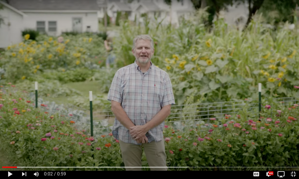 Michael Woods stand in garden to introduce Main Street Farm aGROWhood Initiative.